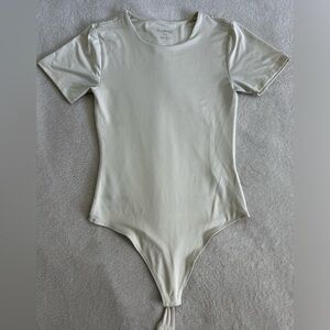 Body-con cream coloured bodysuit size small women’s